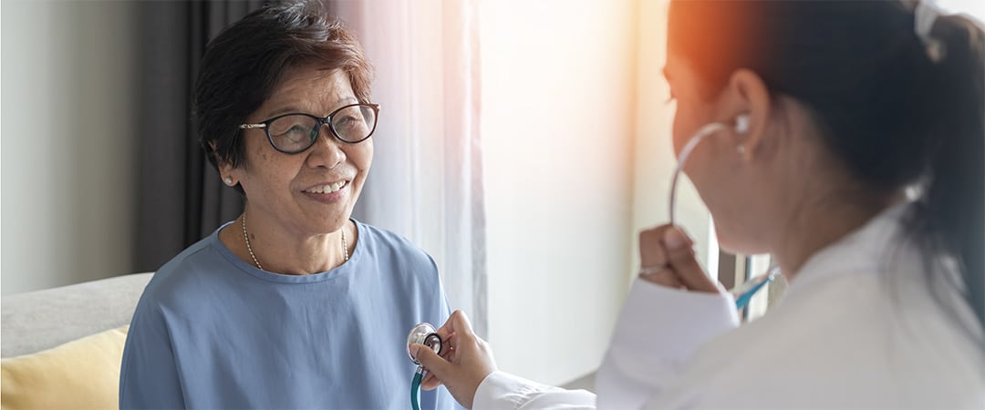 A doctor with a smiling patient.