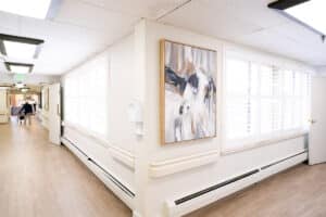 Hallway with painting hung at Amberwood Post Acute